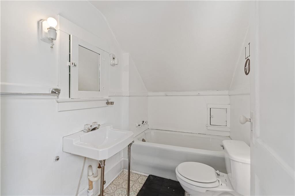 718 Mercer Road Beaver Falls, PA 15010 - Photo 24 of 44 a bathroom with a sink a toilet and shower