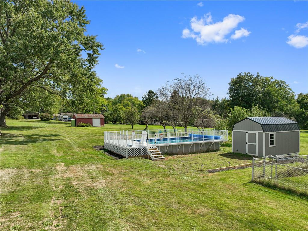 718 Mercer Road Beaver Falls, PA 15010 - Photo 29 of 44 a front view of a house with garden and trees