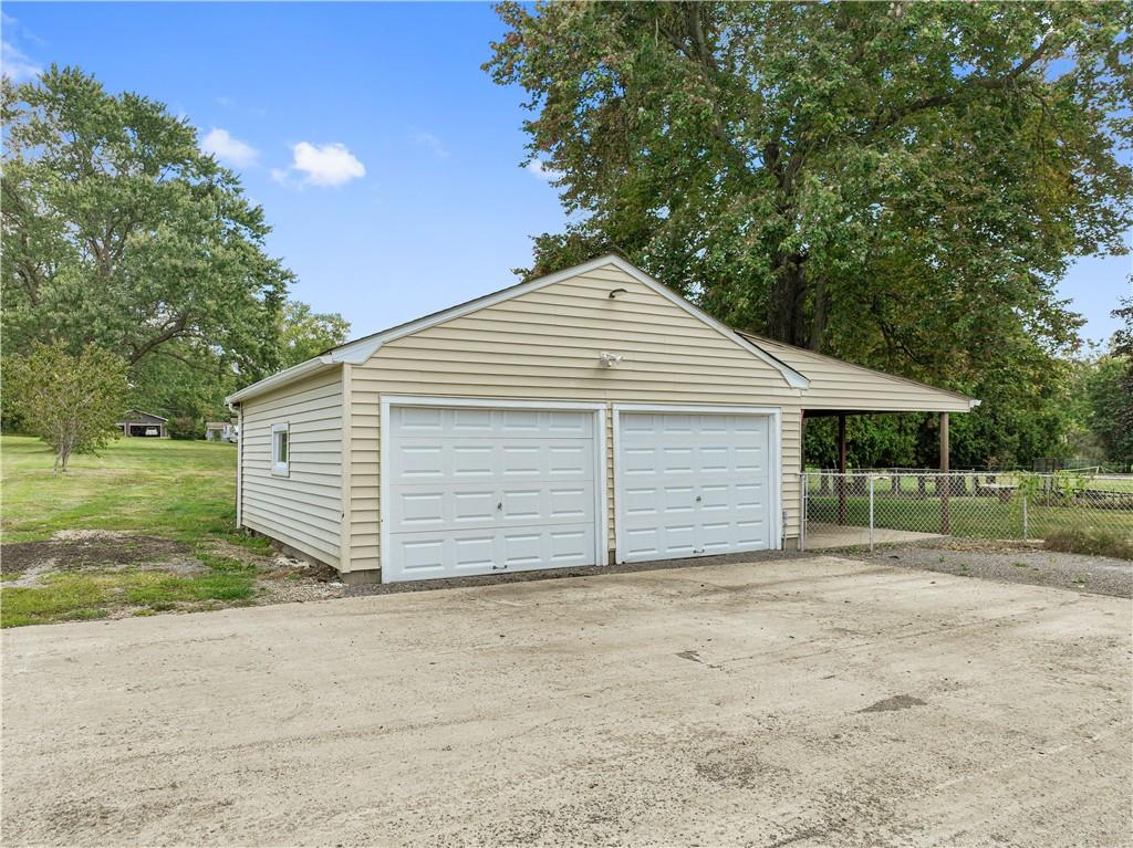 718 Mercer Road Beaver Falls, PA 15010 - Photo 3 of 44 a view of a house with a yard and garage