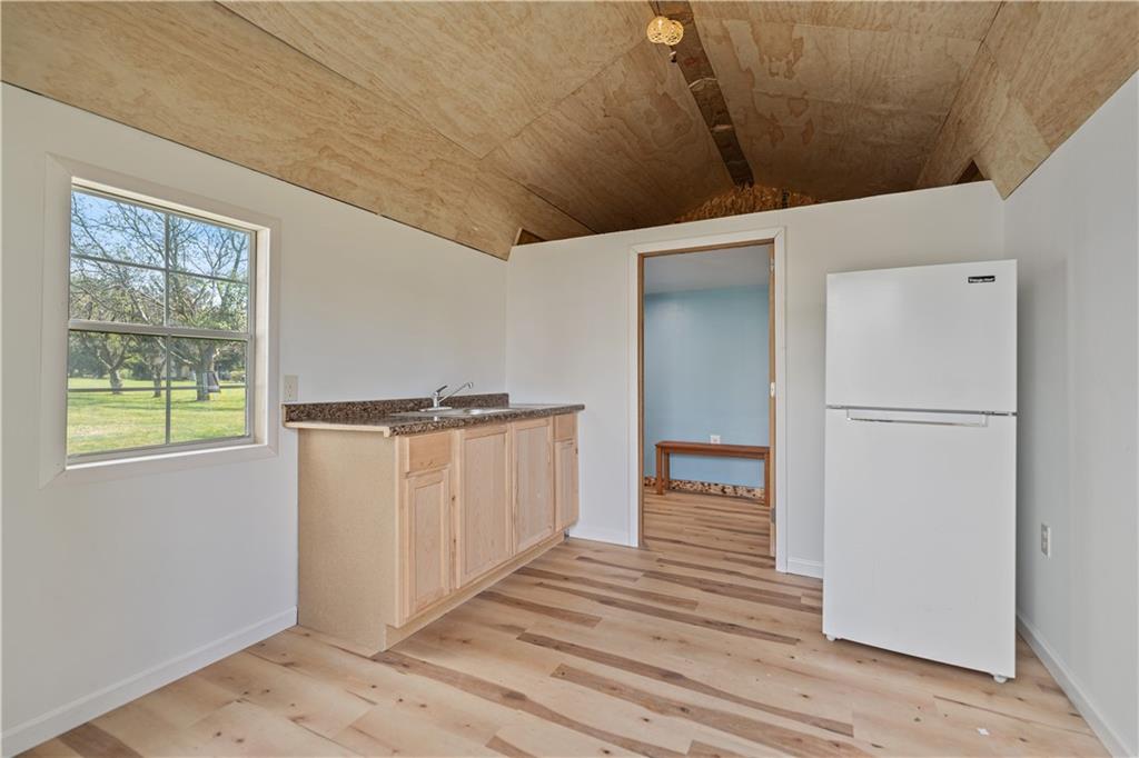 718 Mercer Road Beaver Falls, PA 15010 - Photo 32 of 44 a view of a hallway with wooden floor and staircase