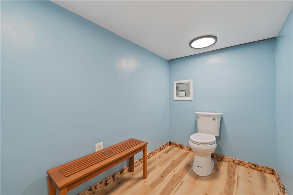 718 Mercer Road Beaver Falls, PA 15010 - Photo 33 of 44 a view of a room with wooden floor and chair