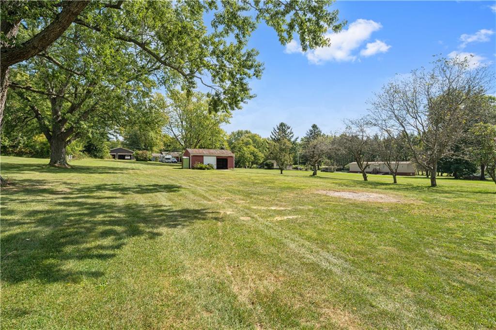 718 Mercer Road Beaver Falls, PA 15010 - Photo 38 of 44 a view of a green field with trees in the background