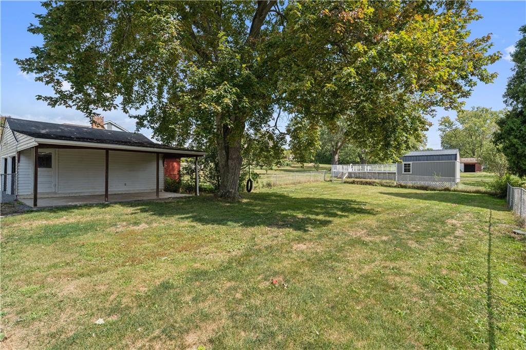 718 Mercer Road Beaver Falls, PA 15010 - Photo 42 of 44 a backyard of a house with table and chairs