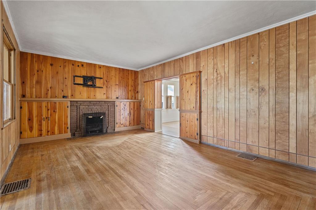 718 Mercer Road Beaver Falls, PA 15010 - Photo 8 of 44 a view of an empty room with a fireplace