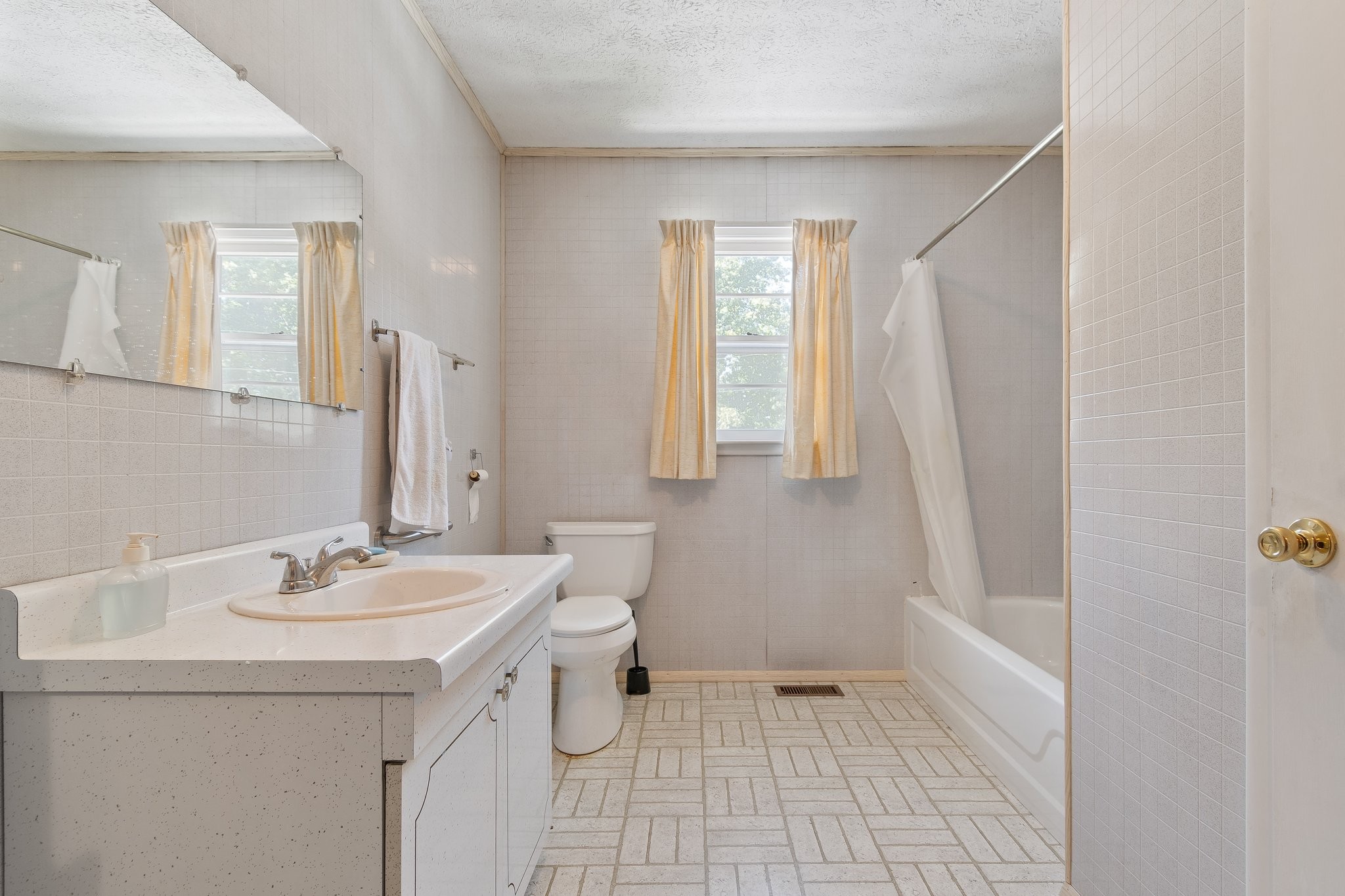 1875 Grays Bend Road Centerville, TN 37033 - Photo 17 of 33 a bathroom with a sink a toilet and a mirror