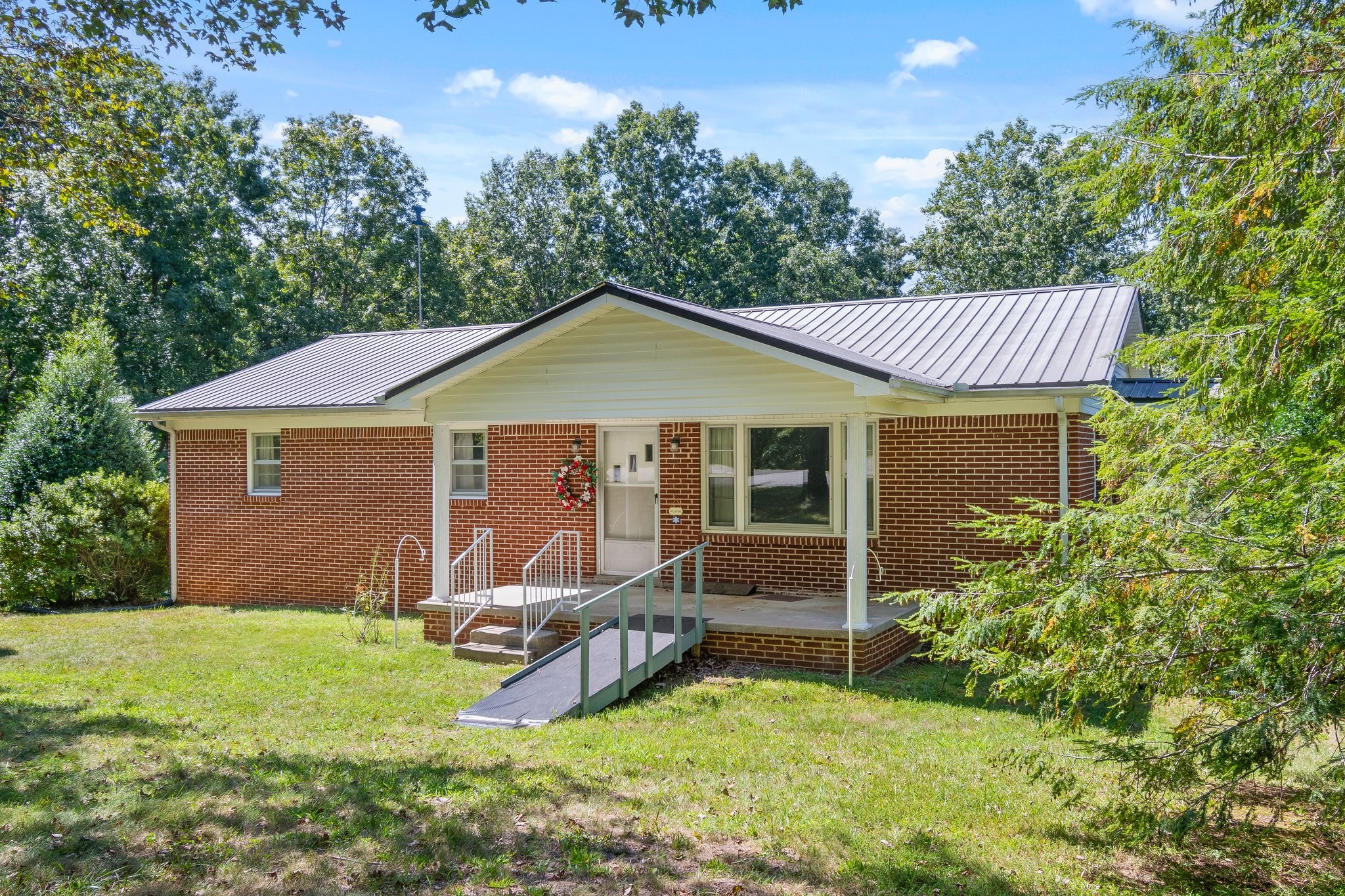 1875 Grays Bend Road Centerville, TN 37033 - Photo 3 of 33 a view of a house with a yard patio and a garden