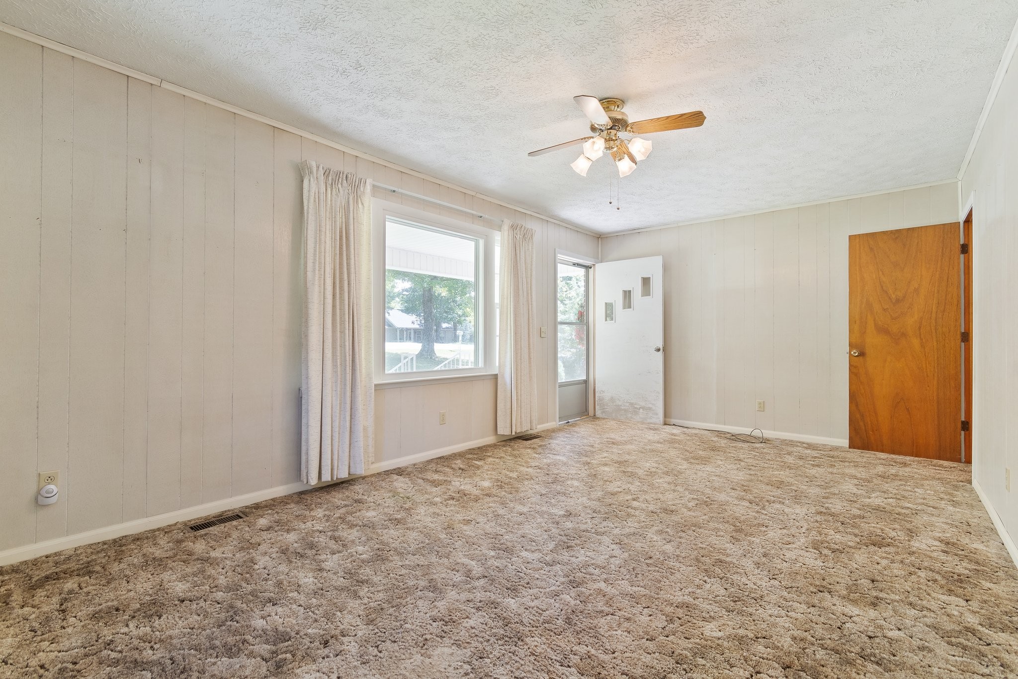 1875 Grays Bend Road Centerville, TN 37033 - Photo 6 of 33 an empty room with chandelier fan and windows