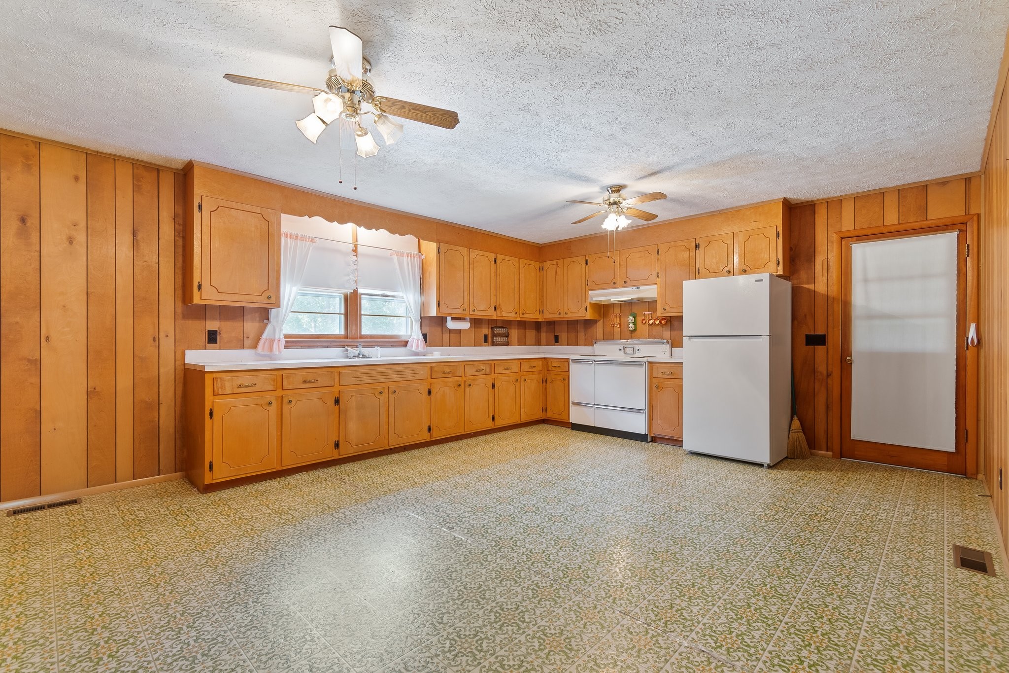 1875 Grays Bend Road Centerville, TN 37033 - Photo 8 of 33 a open kitchen with refrigerator cabinets and a large window