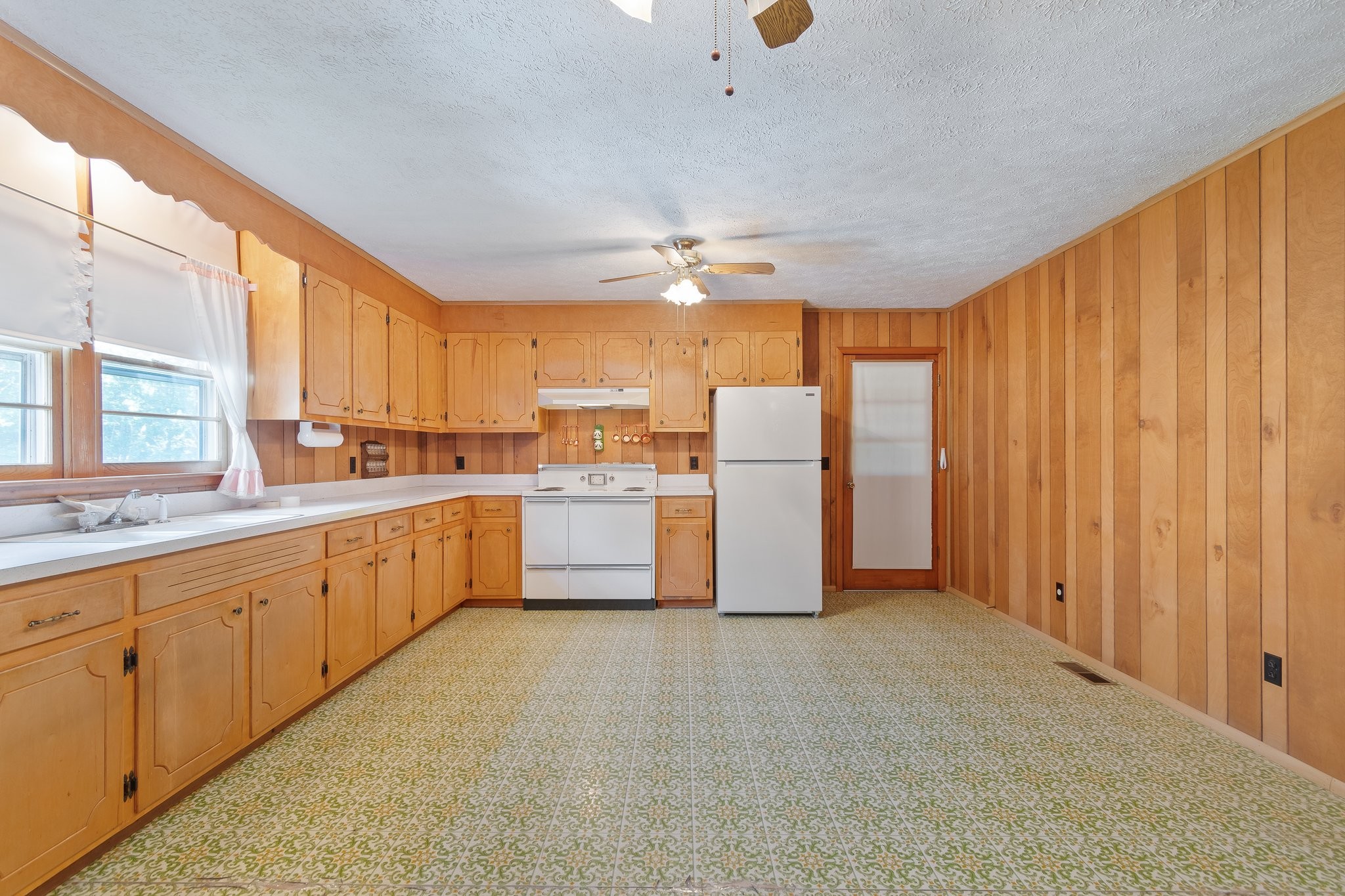 1875 Grays Bend Road Centerville, TN 37033 - Photo 9 of 33 a kitchen with refrigerator and cabinets