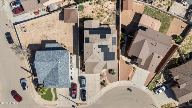 an aerial view of residential houses with outdoor space