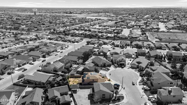 a view of multiple houses with a street