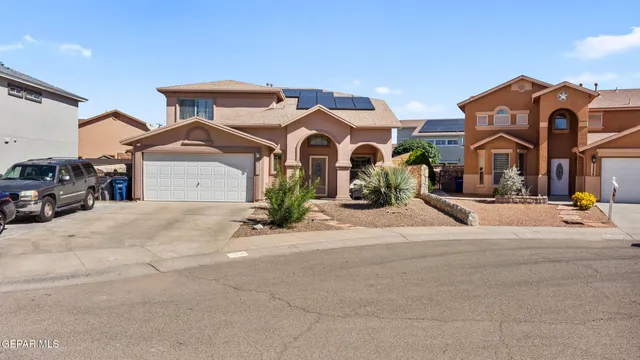 a front view of a house with a outdoor space