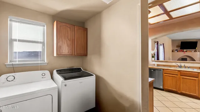 a view of storage and utility room with washer and dryer