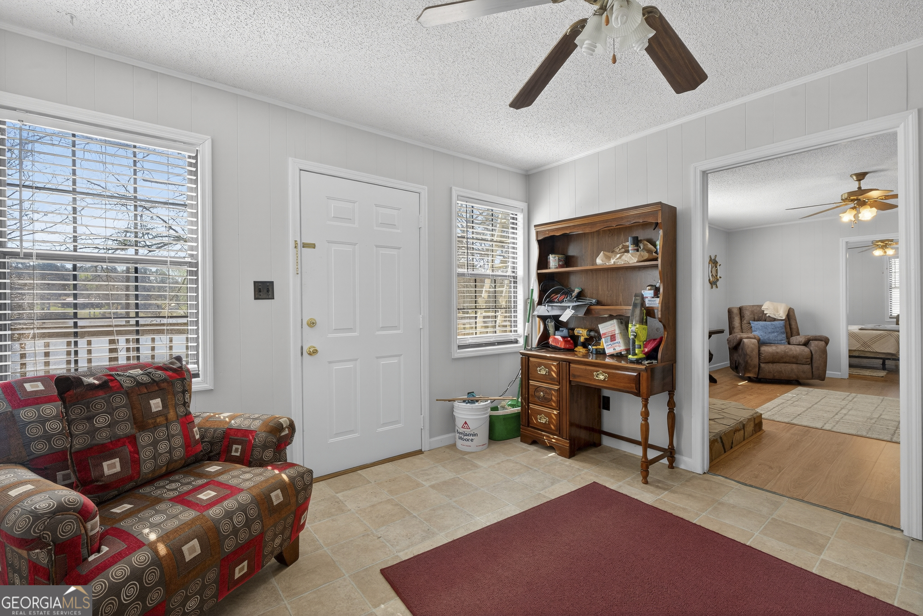 231 B Little Road Northwest Milledgeville, GA 31061 - Photo 26 of 67 a living room with furniture and a window