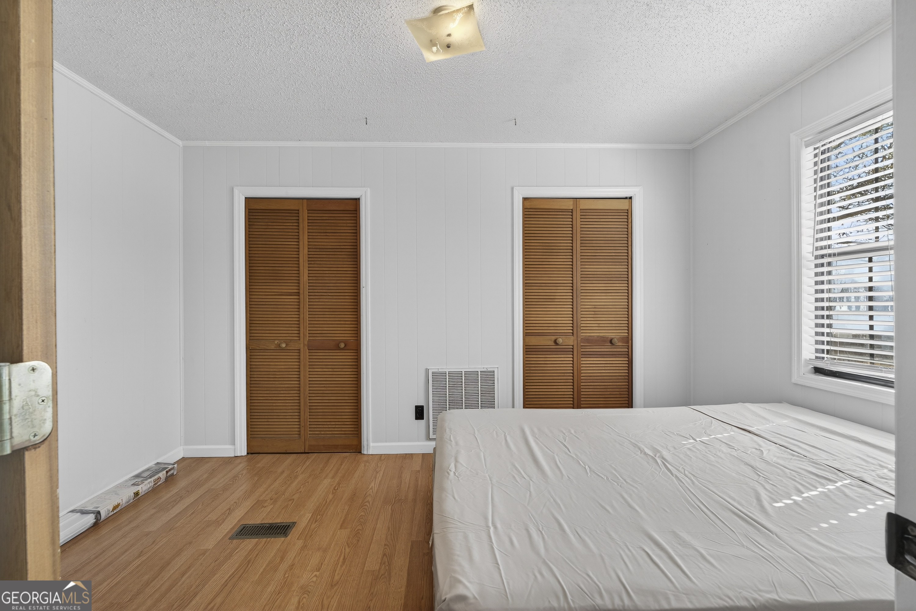 231 B Little Road Northwest Milledgeville, GA 31061 - Photo 28 of 67 a bedroom with a bed and a window