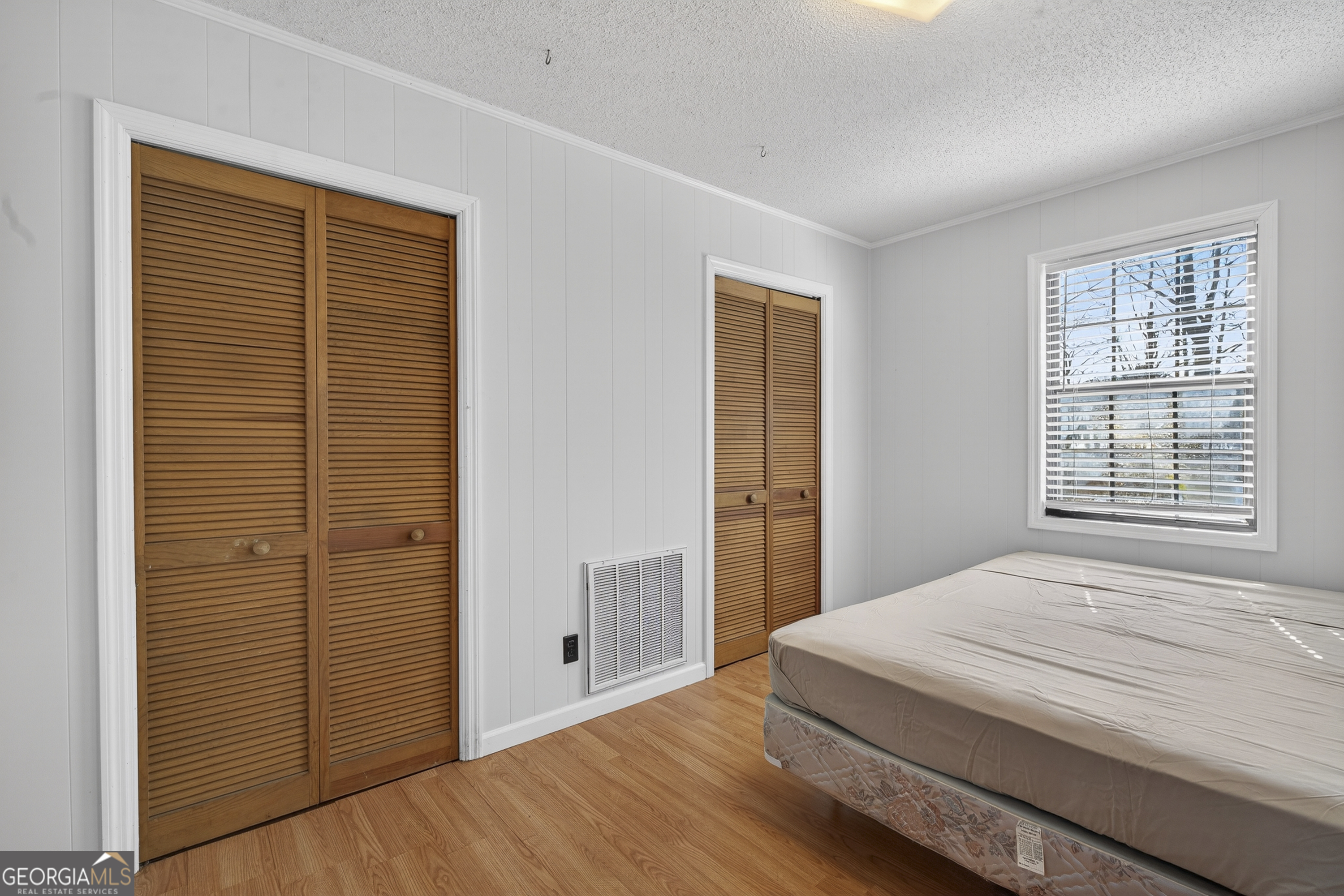 231 B Little Road Northwest Milledgeville, GA 31061 - Photo 29 of 67 a bedroom with a bed and a window