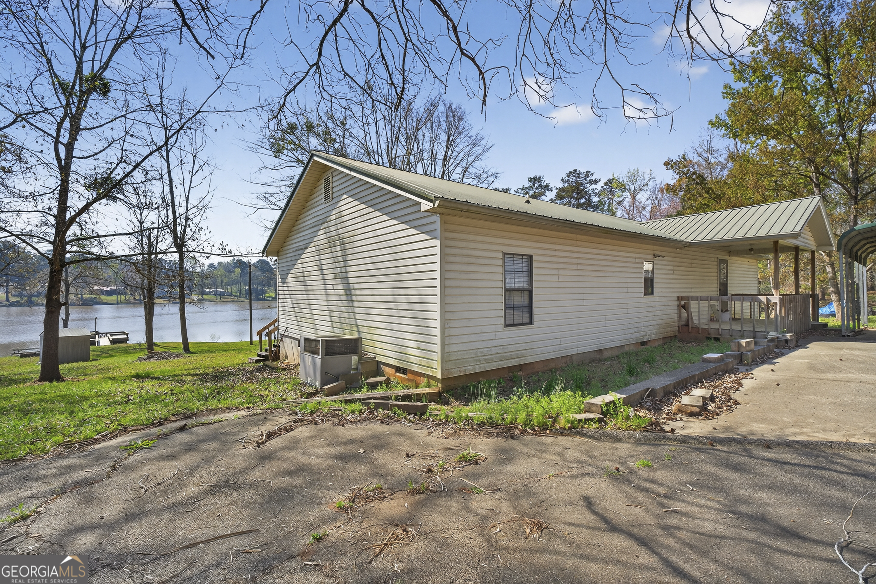 231 B Little Road Northwest Milledgeville, GA 31061 - Photo 3 of 67 a backyard of a house with plants and trees