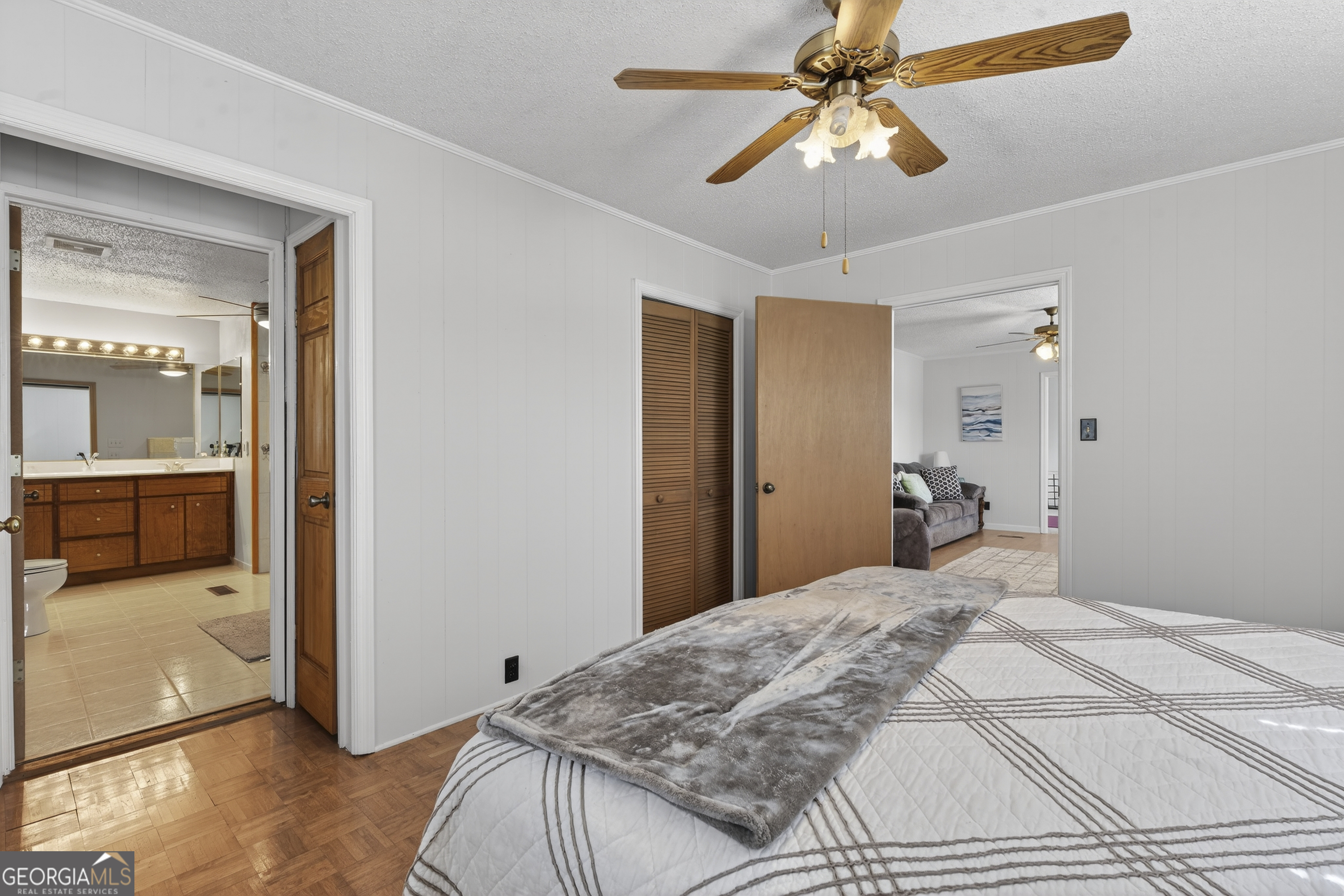 231 B Little Road Northwest Milledgeville, GA 31061 - Photo 33 of 67 a bedroom with a bed and a chandelier