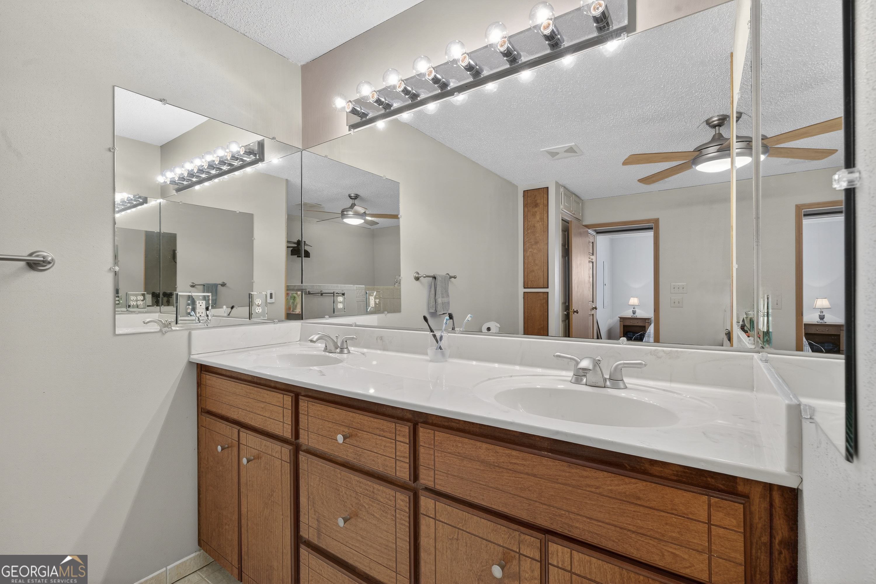 231 B Little Road Northwest Milledgeville, GA 31061 - Photo 38 of 67 a bathroom with a sink double vanity and a mirror