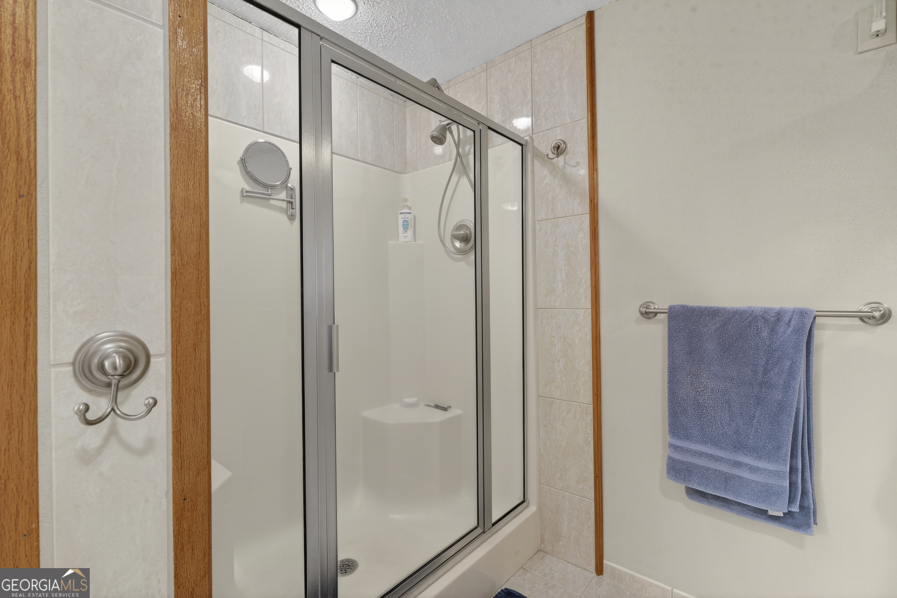 231 B Little Road Northwest Milledgeville, GA 31061 - Photo 39 of 67 a bathroom with a glass shower door and a sink