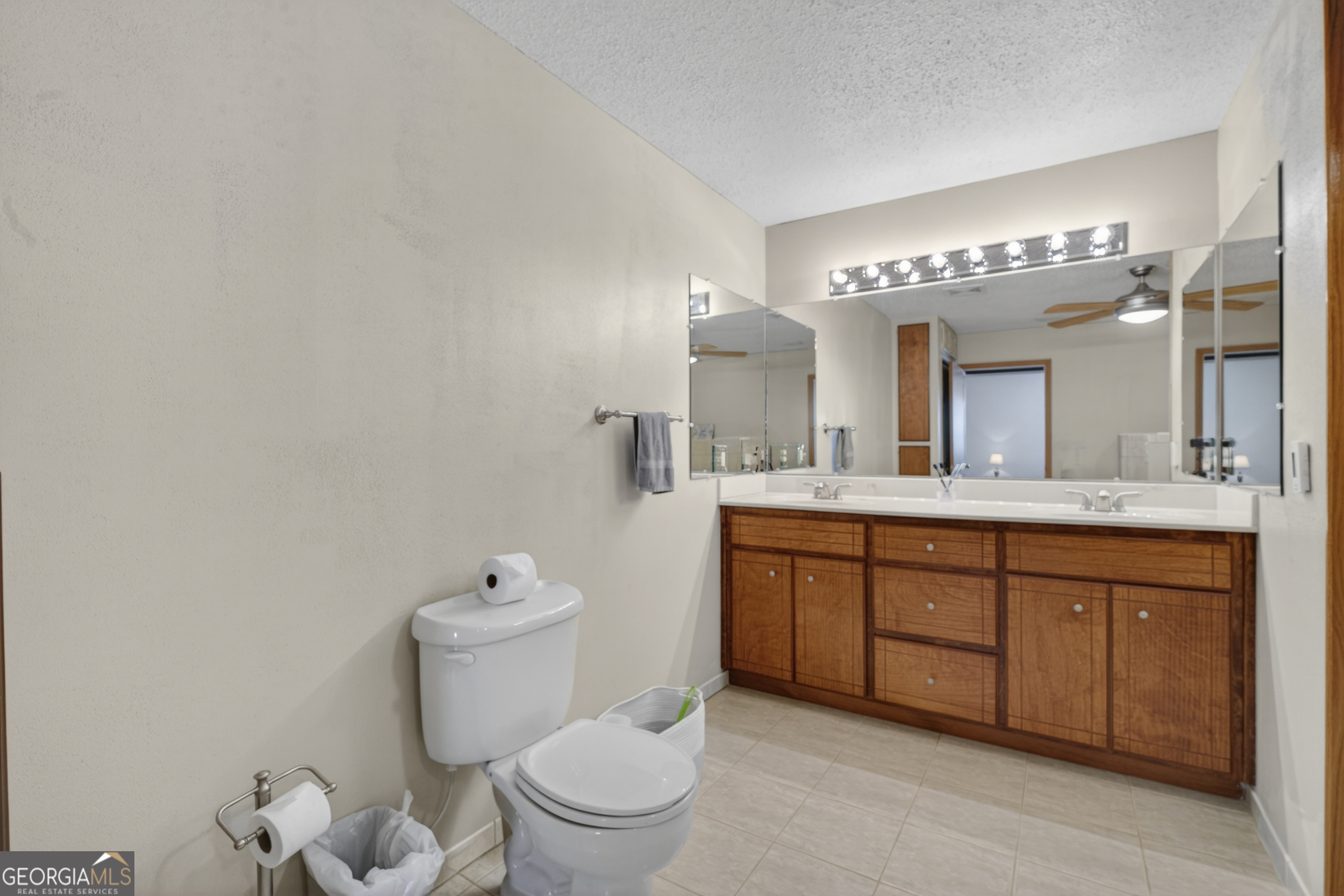 231 B Little Road Northwest Milledgeville, GA 31061 - Photo 40 of 67 a spacious bathroom with a toilet a sink and a mirror