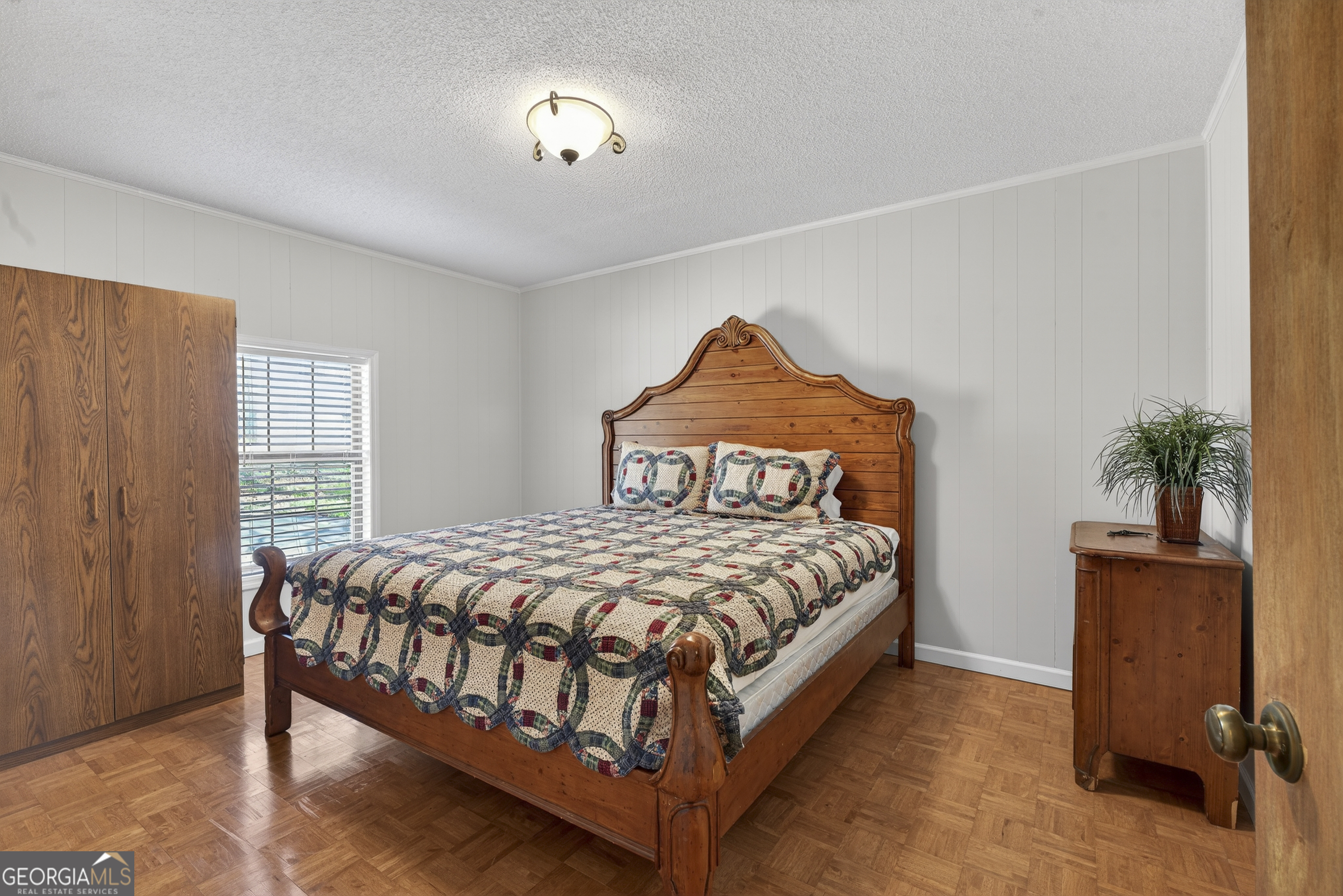 231 B Little Road Northwest Milledgeville, GA 31061 - Photo 41 of 67 a bedroom with a bed and a table in it