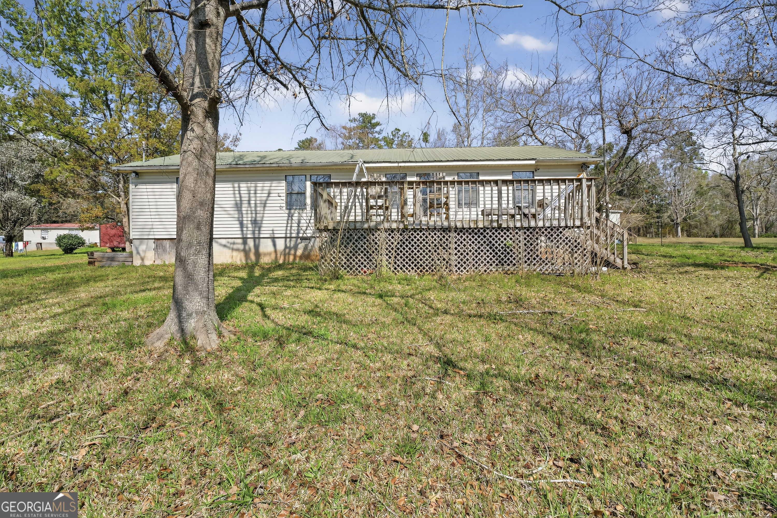231 B Little Road Northwest Milledgeville, GA 31061 - Photo 50 of 67 a view of swimming pool with a yard chairs and a large tree