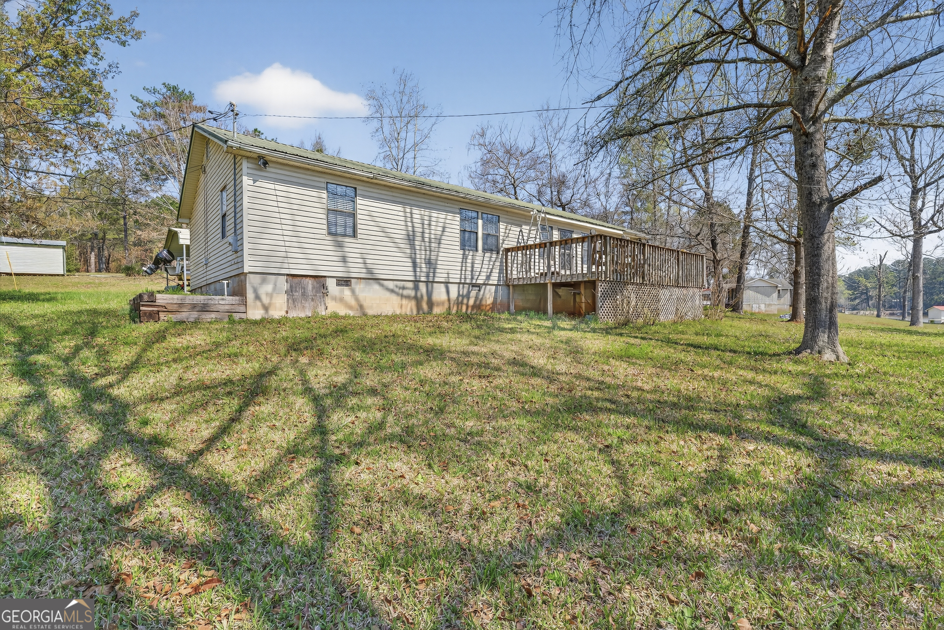 231 B Little Road Northwest Milledgeville, GA 31061 - Photo 51 of 67 a view of a house with a yard