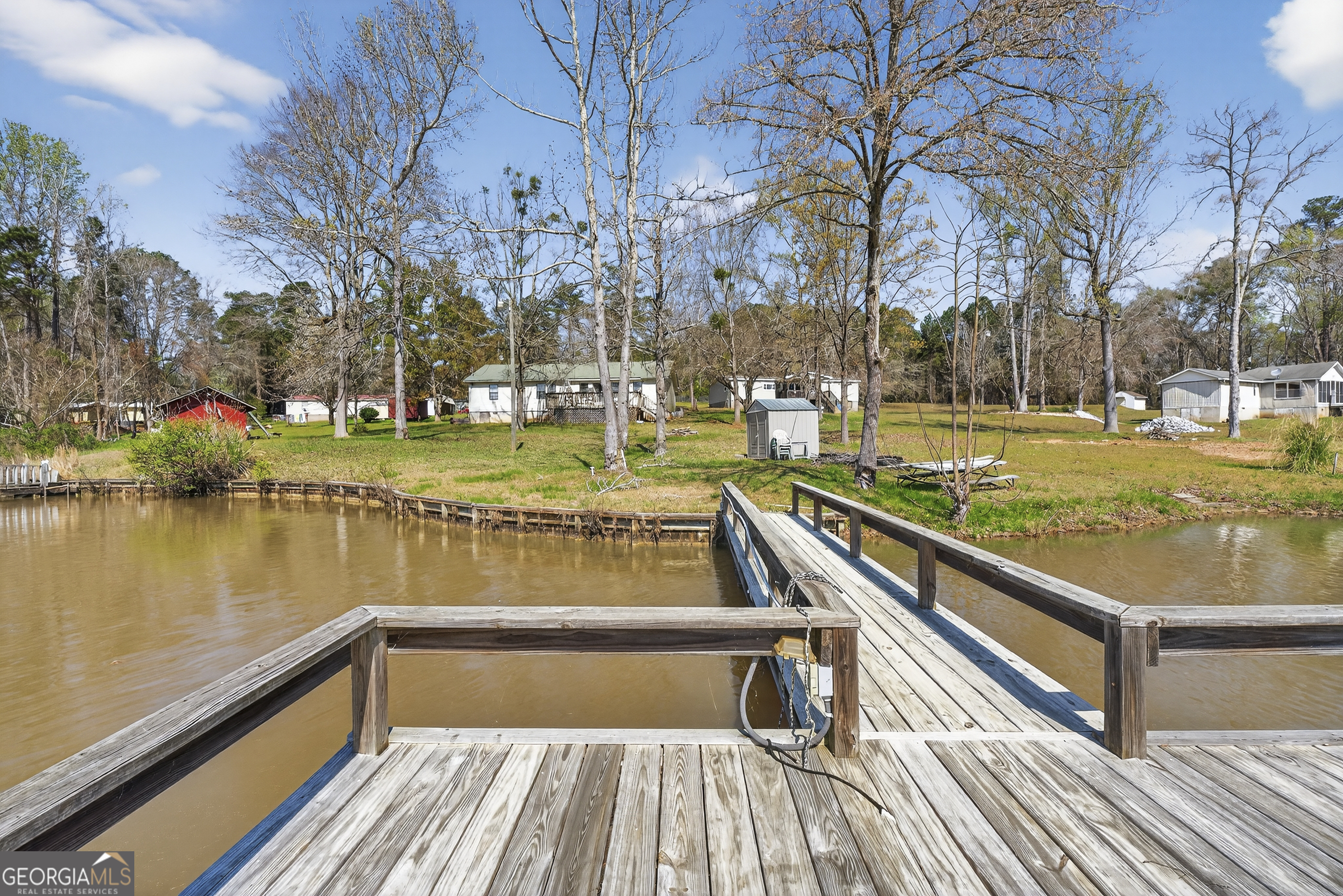 231 B Little Road Northwest Milledgeville, GA 31061 - Photo 57 of 67 a view of swimming pool with seating area and trees around