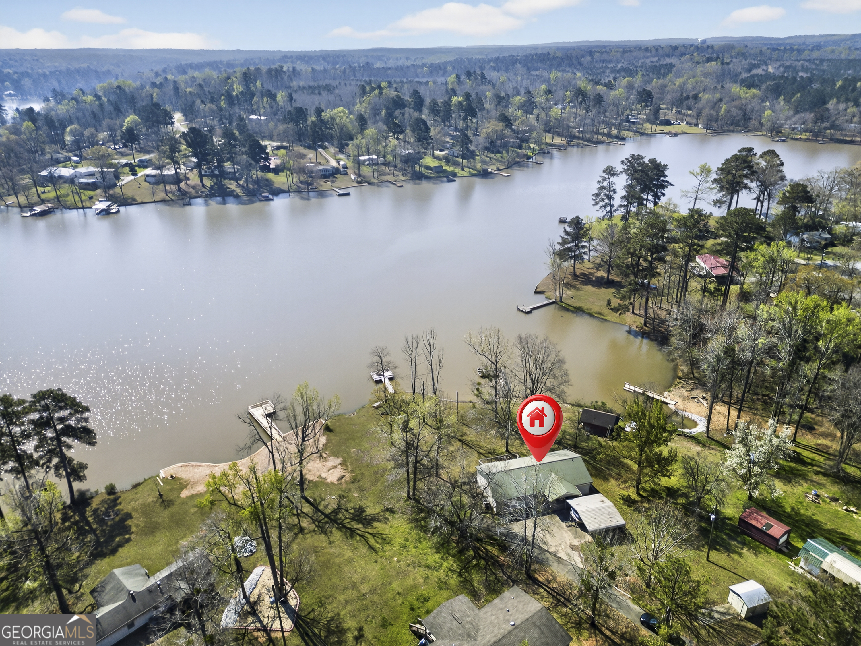 231 B Little Road Northwest Milledgeville, GA 31061 - Photo 58 of 67 an aerial view of lake and residential houses with outdoor space