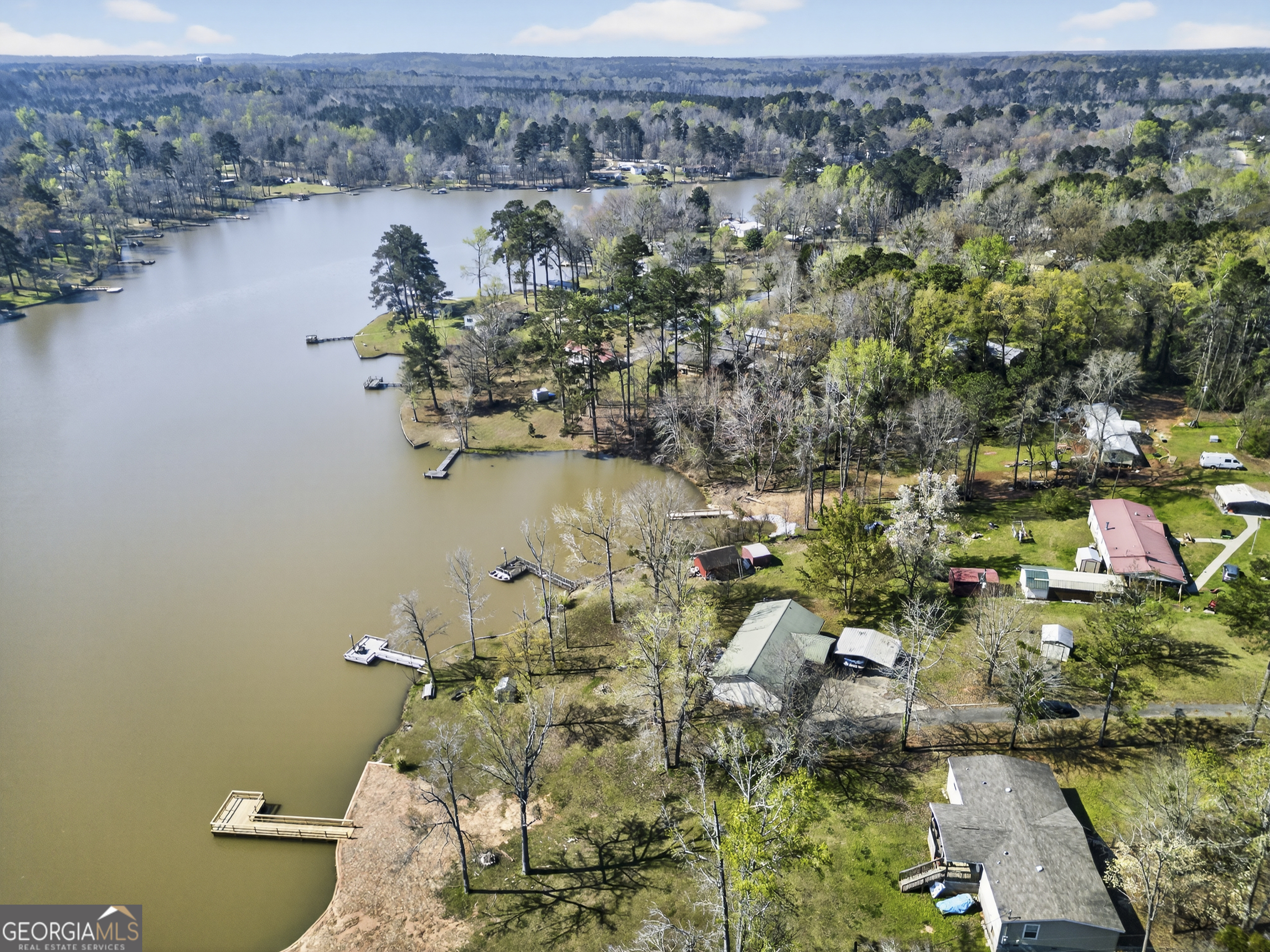 231 B Little Road Northwest Milledgeville, GA 31061 - Photo 59 of 67 an aerial view of a house with a yard and lake view