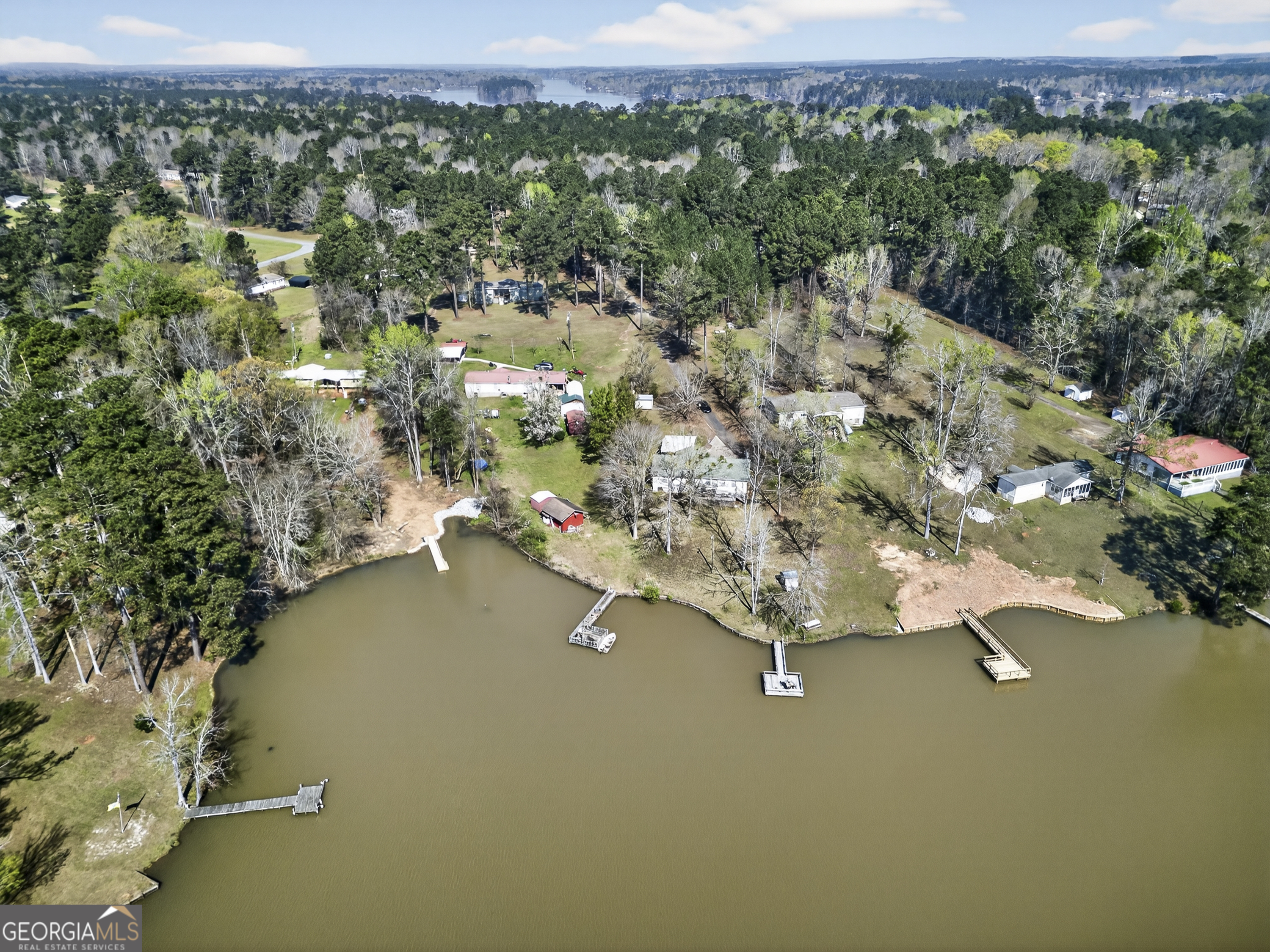 231 B Little Road Northwest Milledgeville, GA 31061 - Photo 61 of 67 an aerial view of a house with a yard and lake view