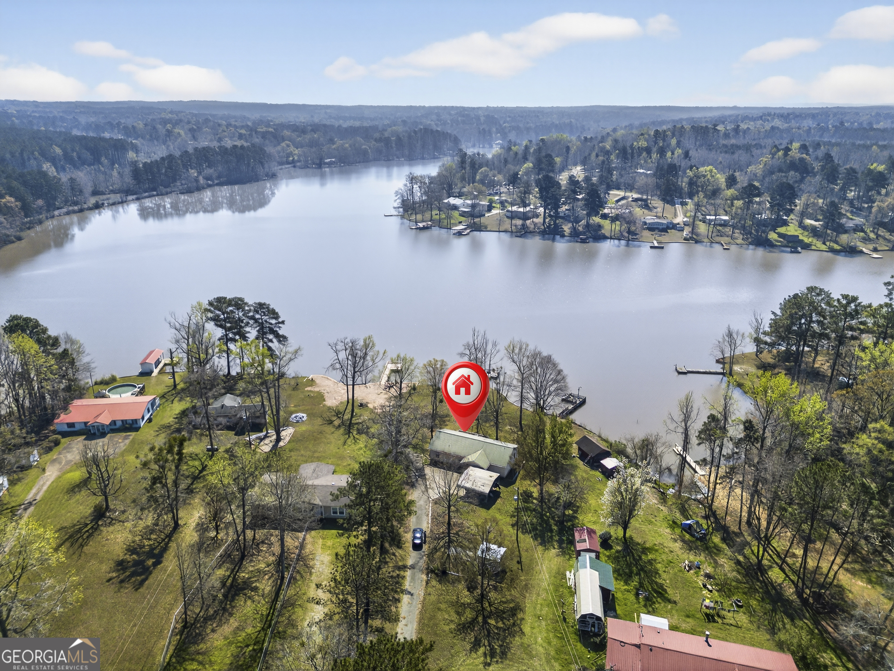231 B Little Road Northwest Milledgeville, GA 31061 - Photo 66 of 67 an aerial view of residential houses with outdoor space and lake view