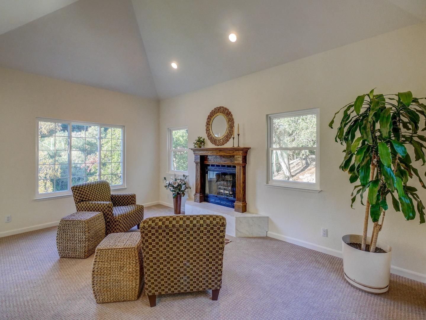 40 Nunes Road Watsonville, CA 95076 - Photo 17 of 42 a living room with furniture and a fireplace