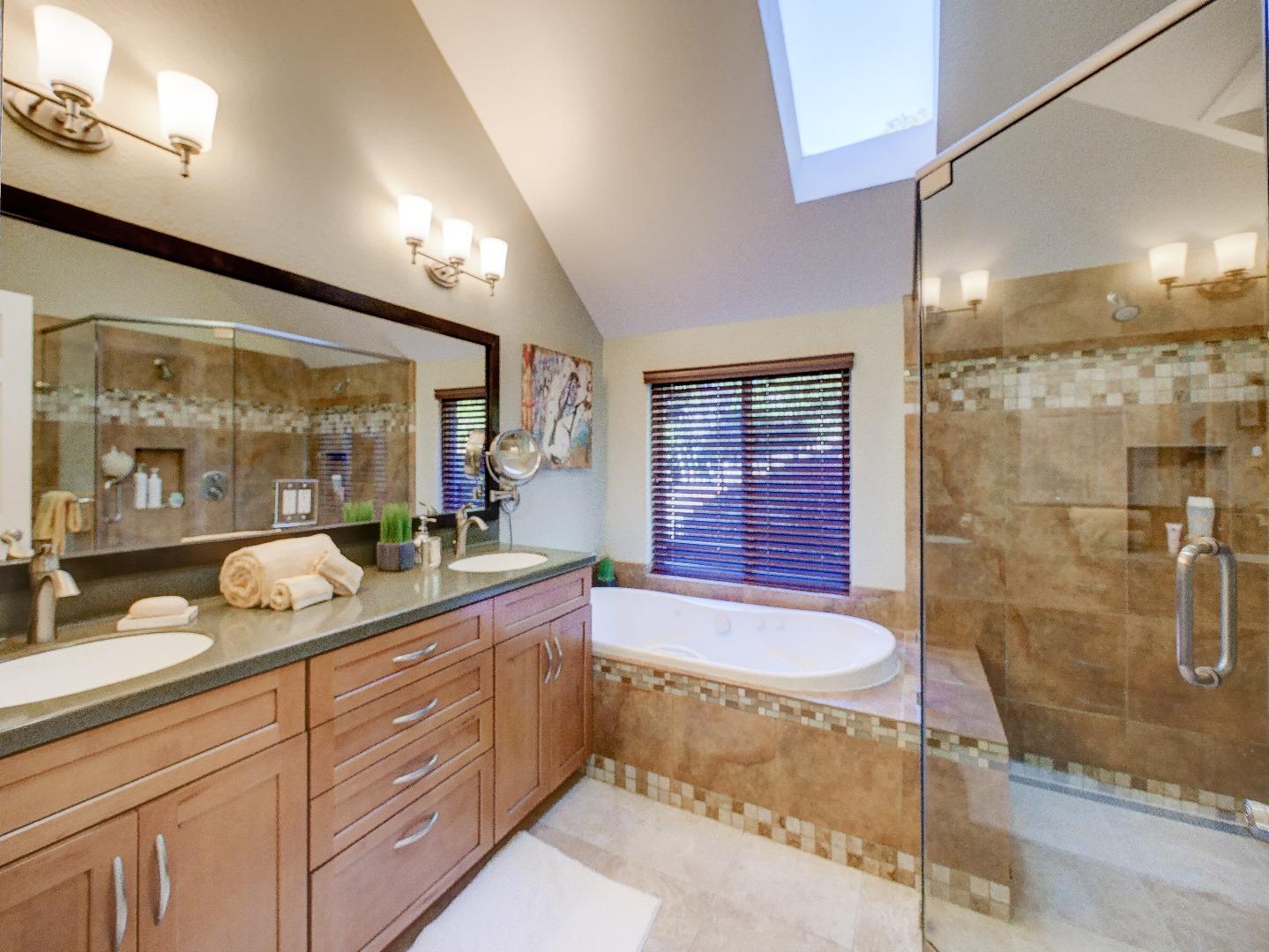 40 Nunes Road Watsonville, CA 95076 - Photo 19 of 42 a spacious bathroom with a granite countertop sink mirror and shower