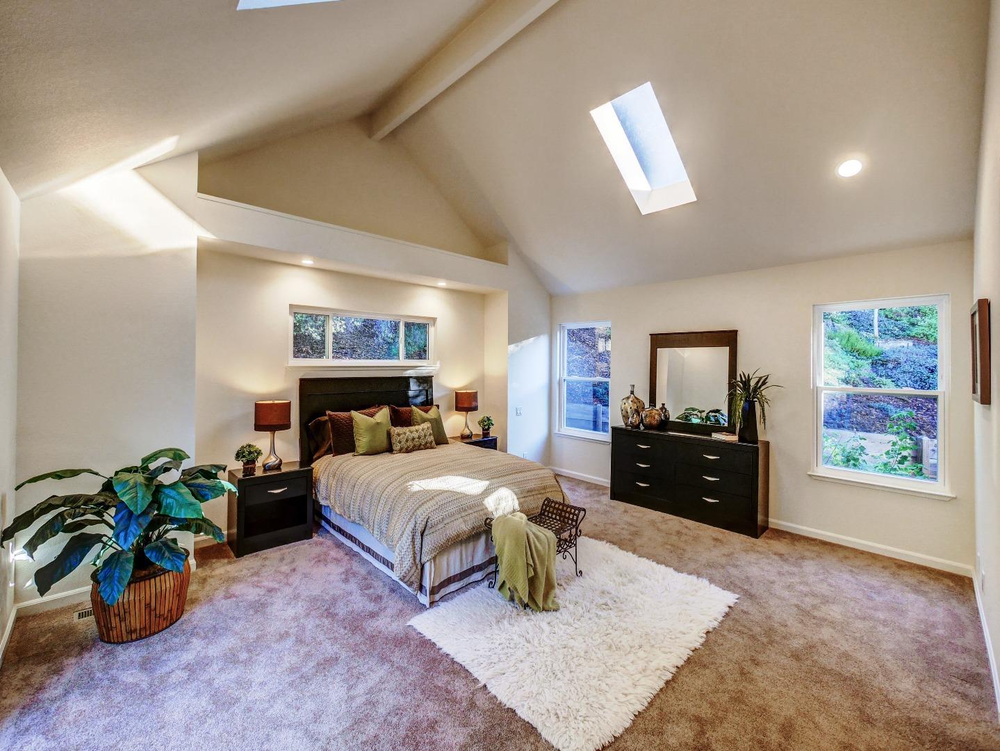 40 Nunes Road Watsonville, CA 95076 - Photo 21 of 42 a bedroom with a bed and dresser with mirror