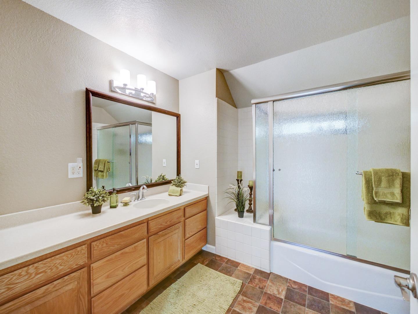 40 Nunes Road Watsonville, CA 95076 - Photo 28 of 42 a spacious bathroom with a double vanity sink and a mirror