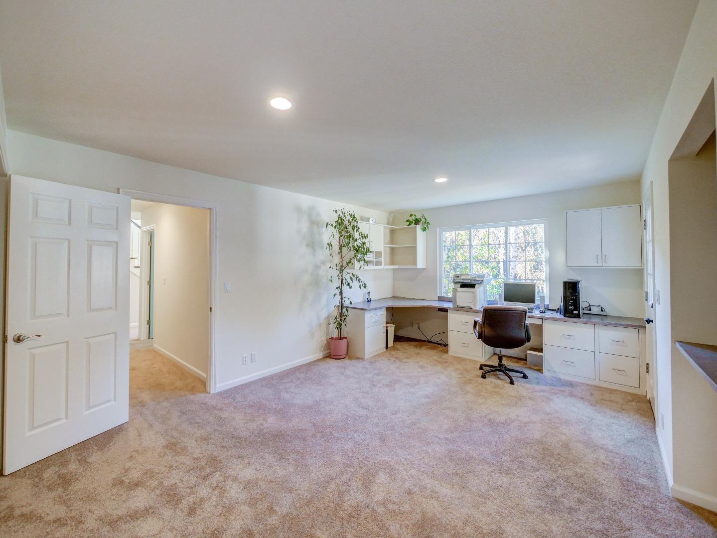 40 Nunes Road Watsonville, CA 95076 - Photo 30 of 42 a view of workspace with wooden floor and white cabinet
