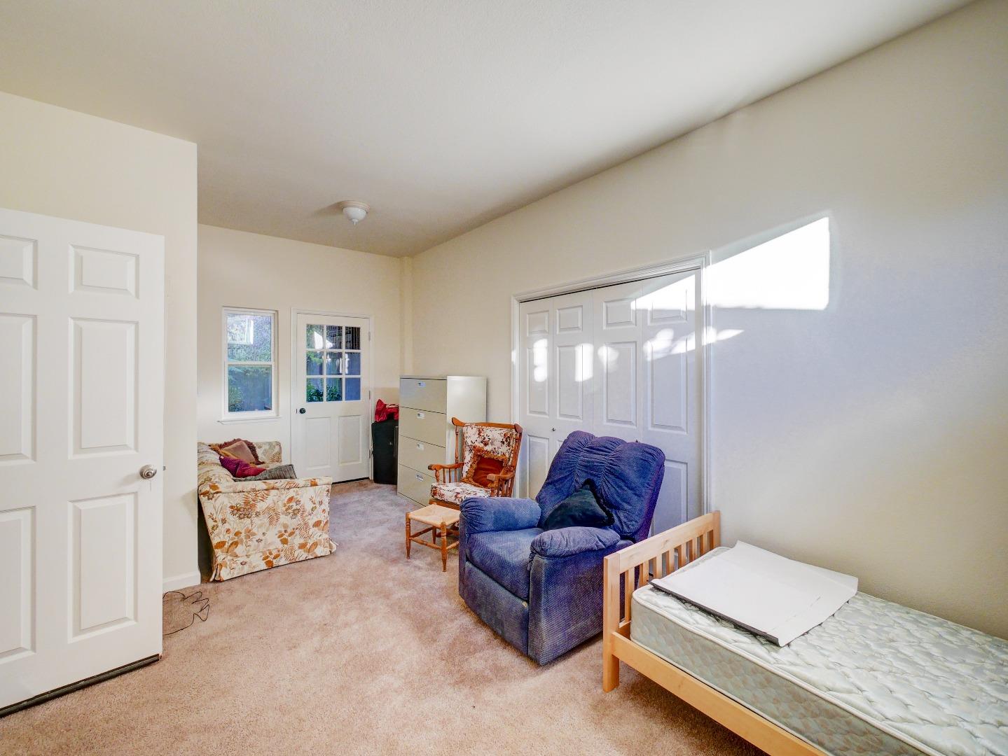 40 Nunes Road Watsonville, CA 95076 - Photo 40 of 42 a living room with furniture and a lamp