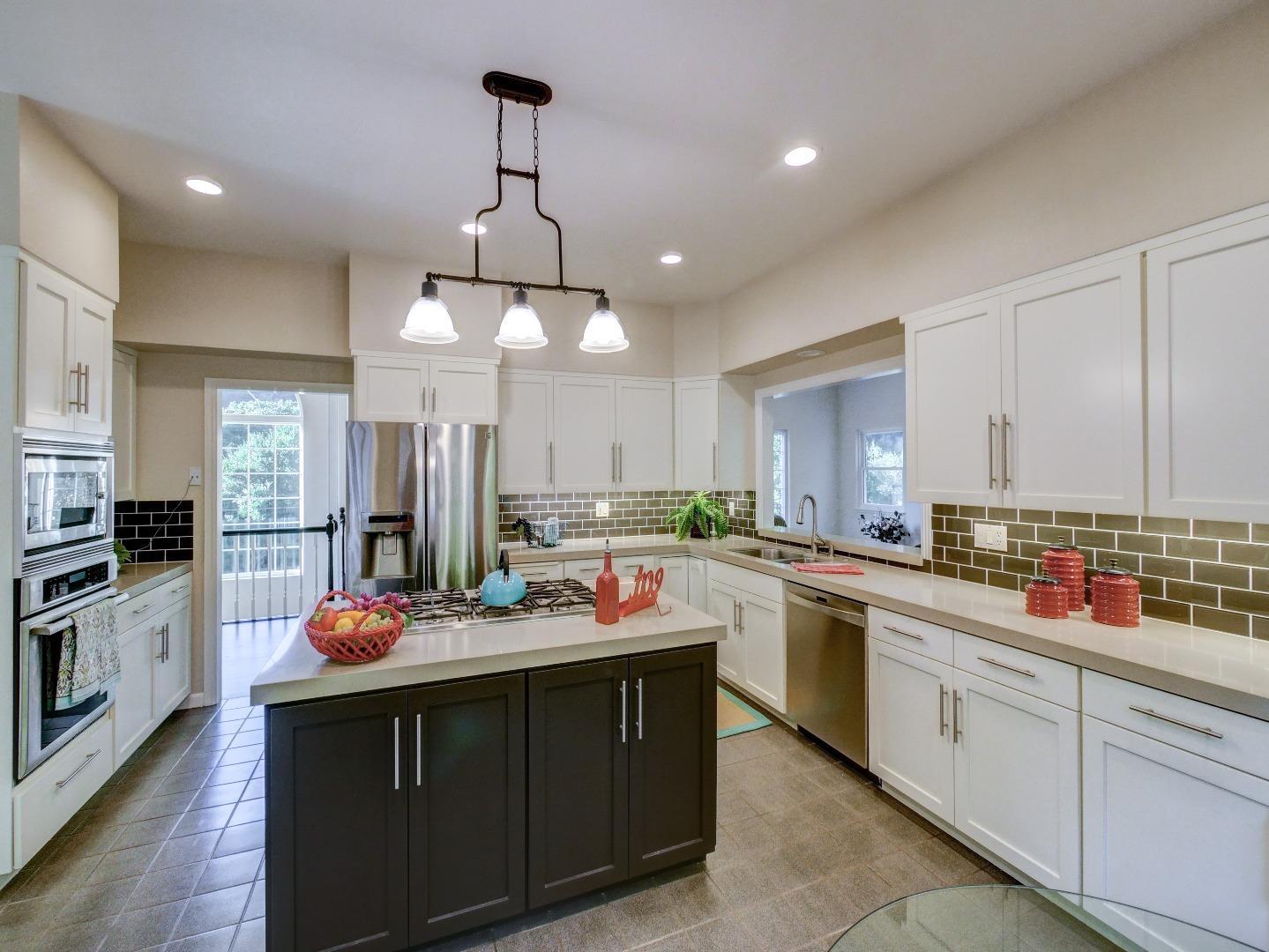 40 Nunes Road Watsonville, CA 95076 - Photo 4 of 42 a kitchen with a sink stove and cabinets