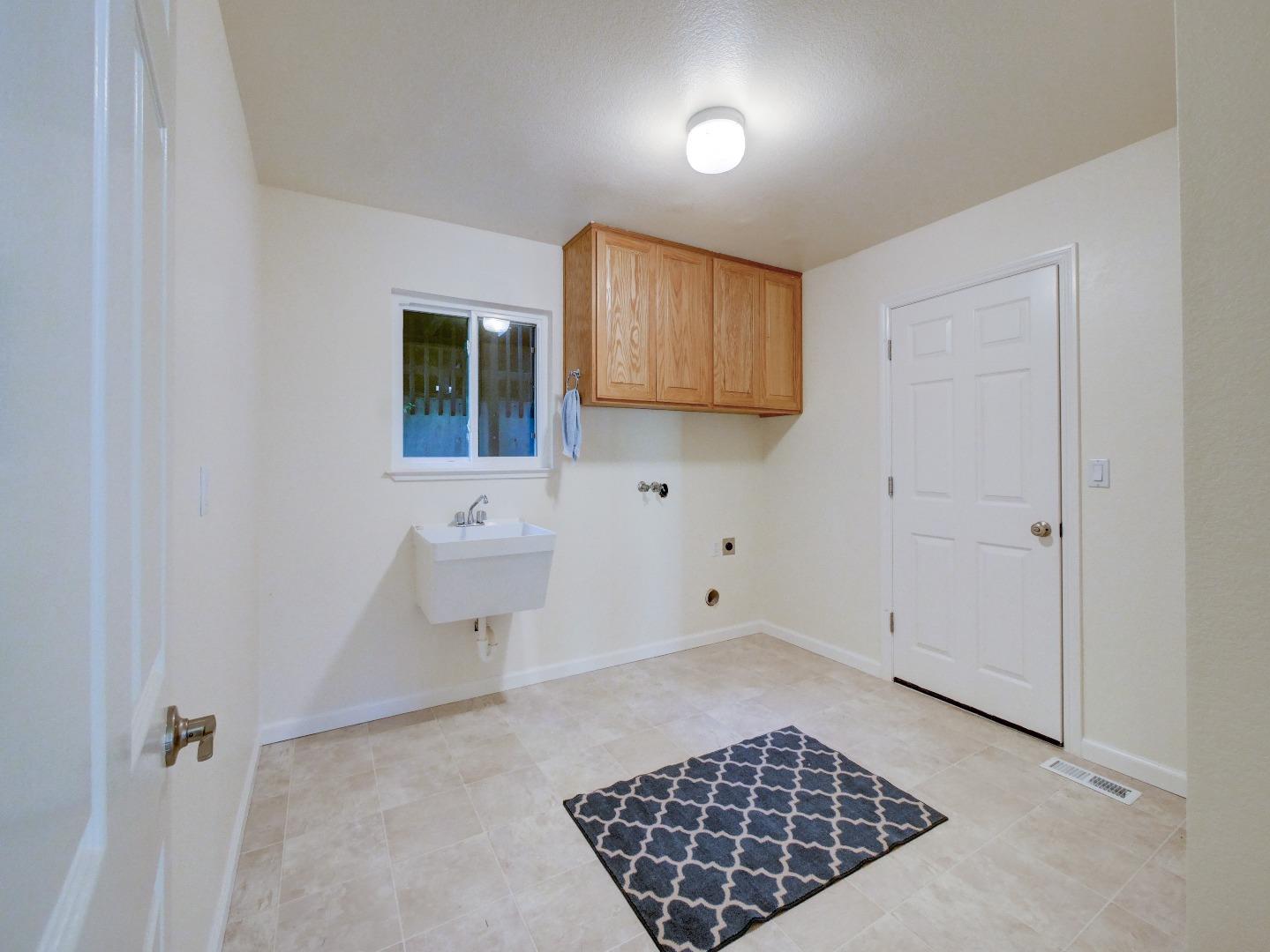 40 Nunes Road Watsonville, CA 95076 - Photo 41 of 42 a bathroom with a toilet a sink and a window