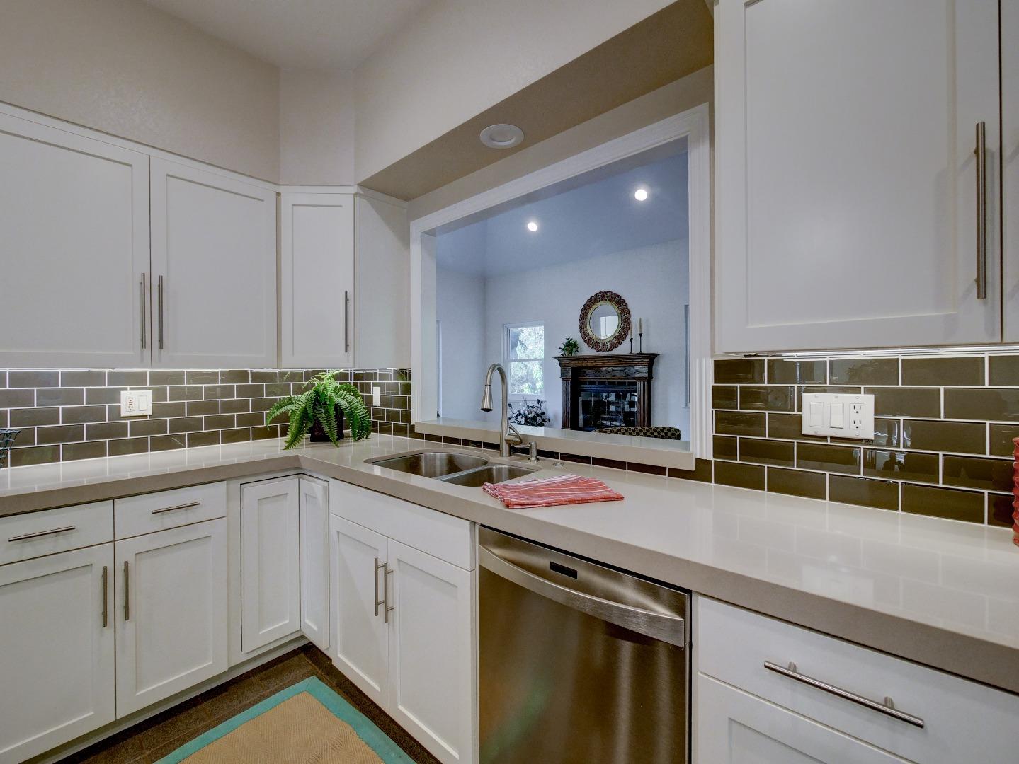 40 Nunes Road Watsonville, CA 95076 - Photo 6 of 42 a kitchen with a sink and cabinets