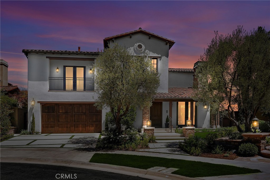 11 Hidden Pass Newport Coast, CA 92657 - Photo 1 of 59 a front view of a house with garden