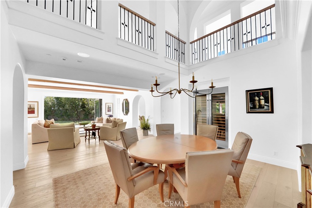 11 Hidden Pass Newport Coast, CA 92657 - Photo 12 of 59 a view of a dining room with furniture window and wooden floor