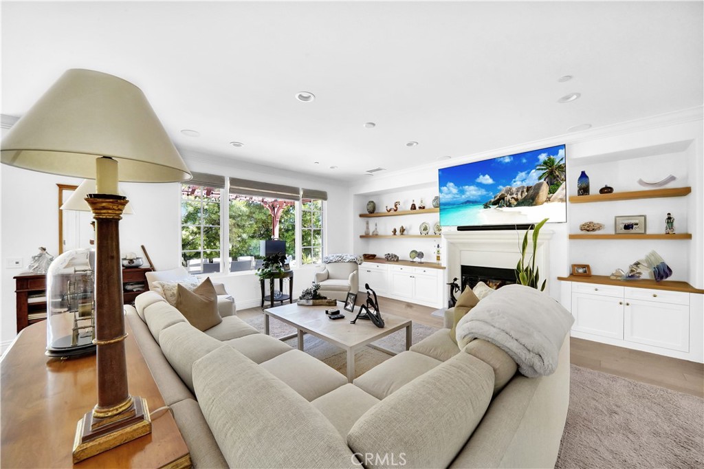 11 Hidden Pass Newport Coast, CA 92657 - Photo 18 of 59 a living room with furniture and a fireplace
