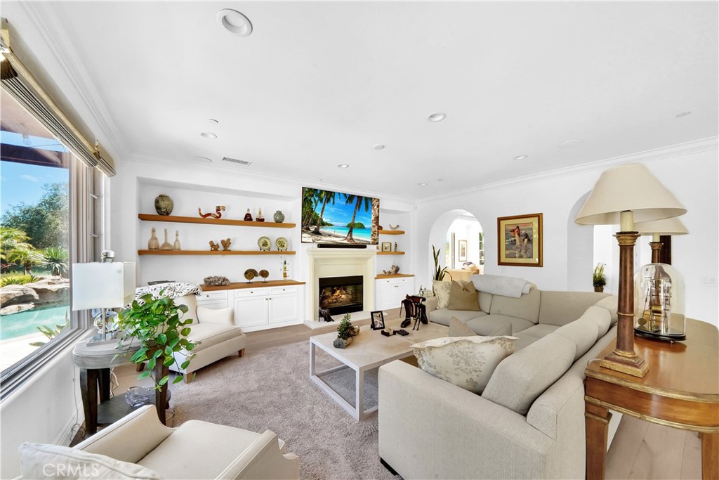 11 Hidden Pass Newport Coast, CA 92657 - Photo 19 of 59 a living room with furniture and a flat screen tv