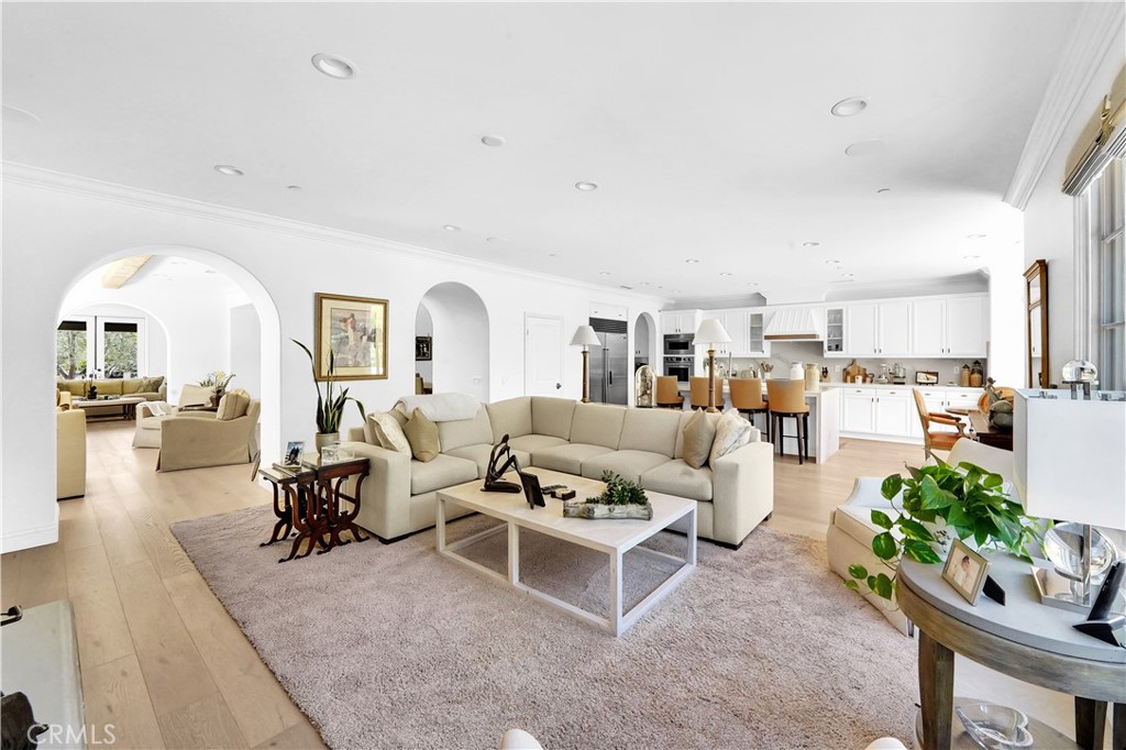 11 Hidden Pass Newport Coast, CA 92657 - Photo 20 of 59 a living room with furniture white floor and a view of kitchen