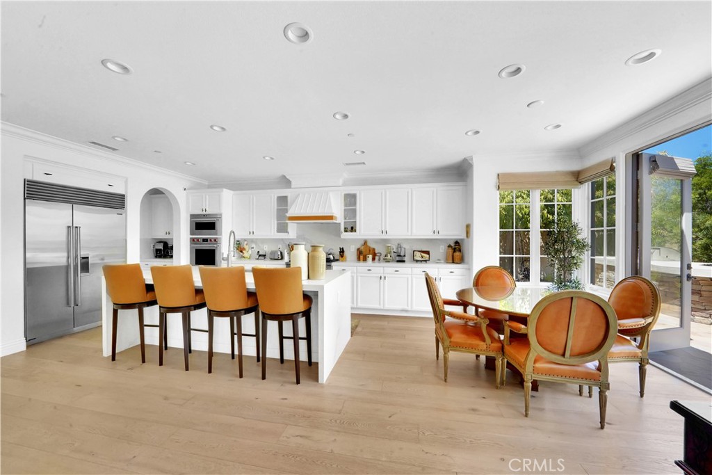 11 Hidden Pass Newport Coast, CA 92657 - Photo 23 of 59 a living room with lots of furniture kitchen view and a large window