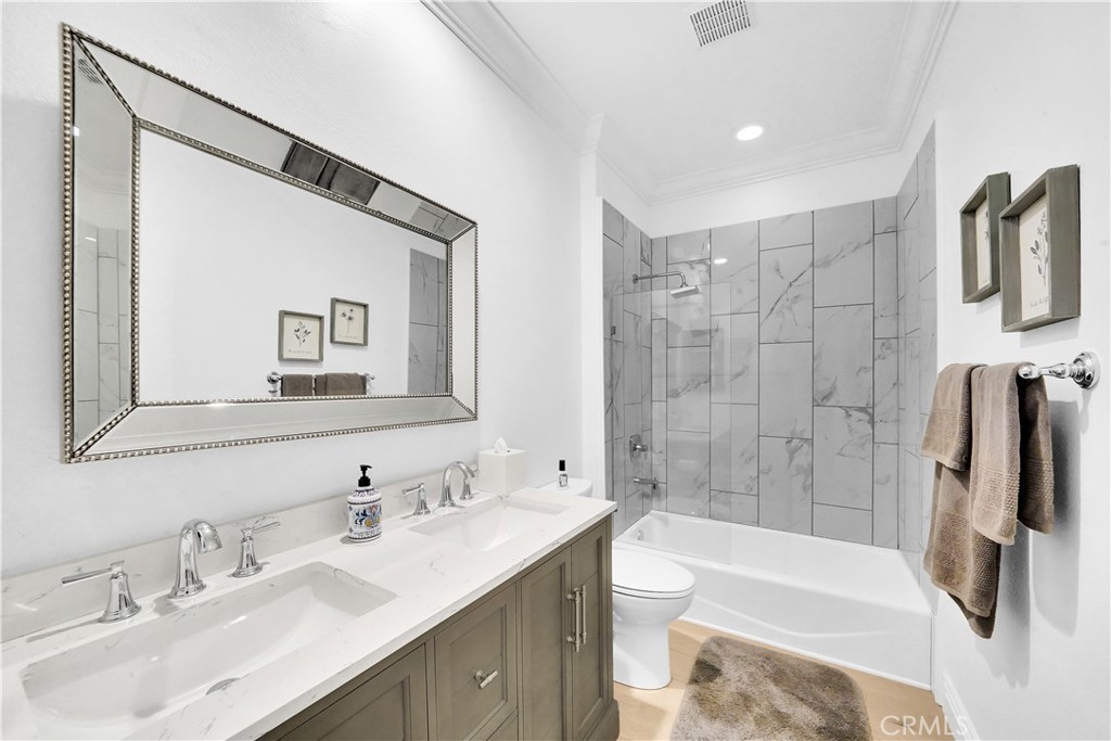 11 Hidden Pass Newport Coast, CA 92657 - Photo 29 of 59 a bathroom with a tub sink and a mirror