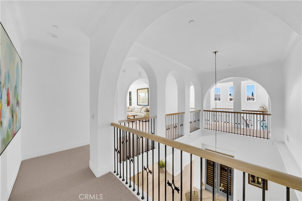 11 Hidden Pass Newport Coast, CA 92657 - Photo 41 of 59 a view of a hallway with windows